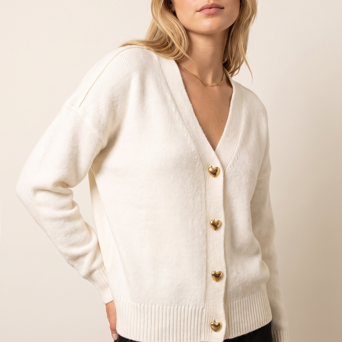 Heart Button V-Neck Knit Cardigan in White, 3/4 angle