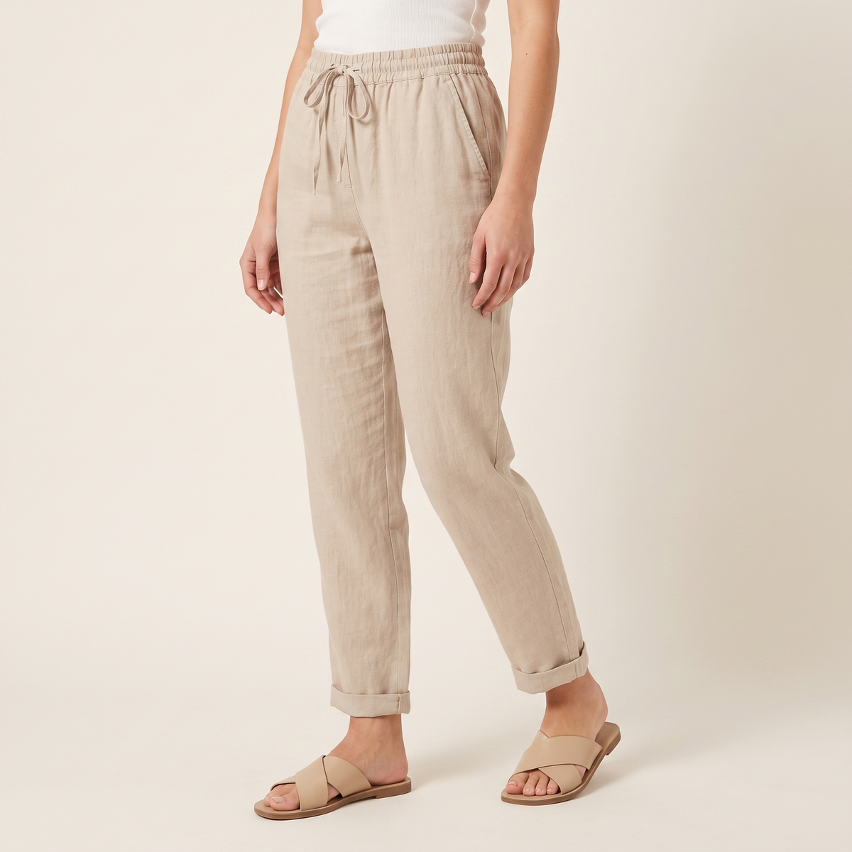 Women's Textured Drawstring Trousers in Beige, 3/4 angle